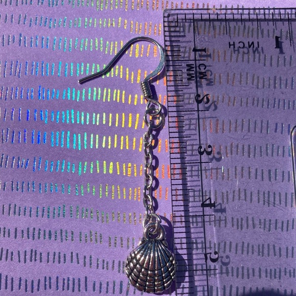 Long dangling earrings in a sea shell shape. - Picture 6 of 7